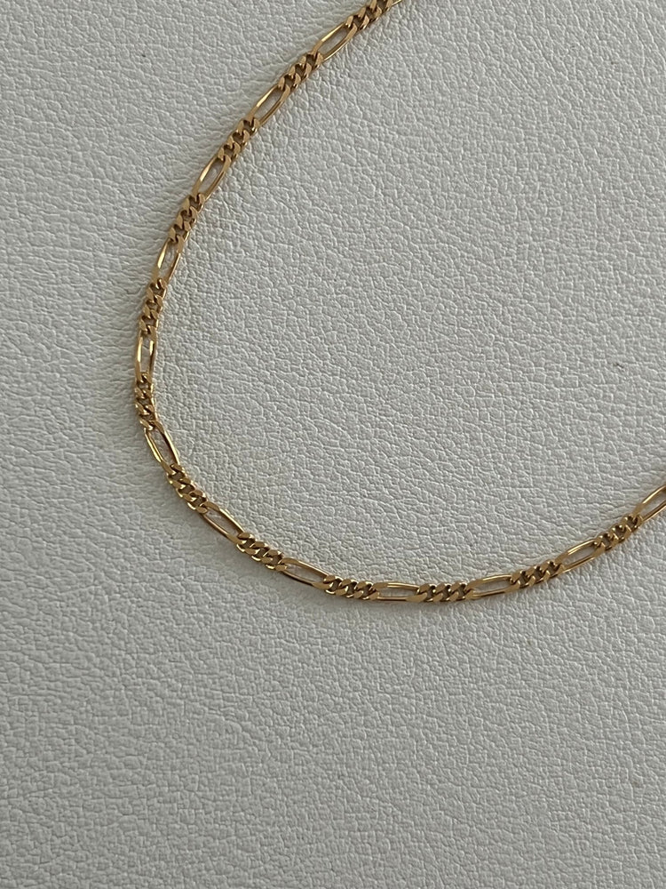 
                  
                    14k figaro bracelet - gldn grl
                  
                