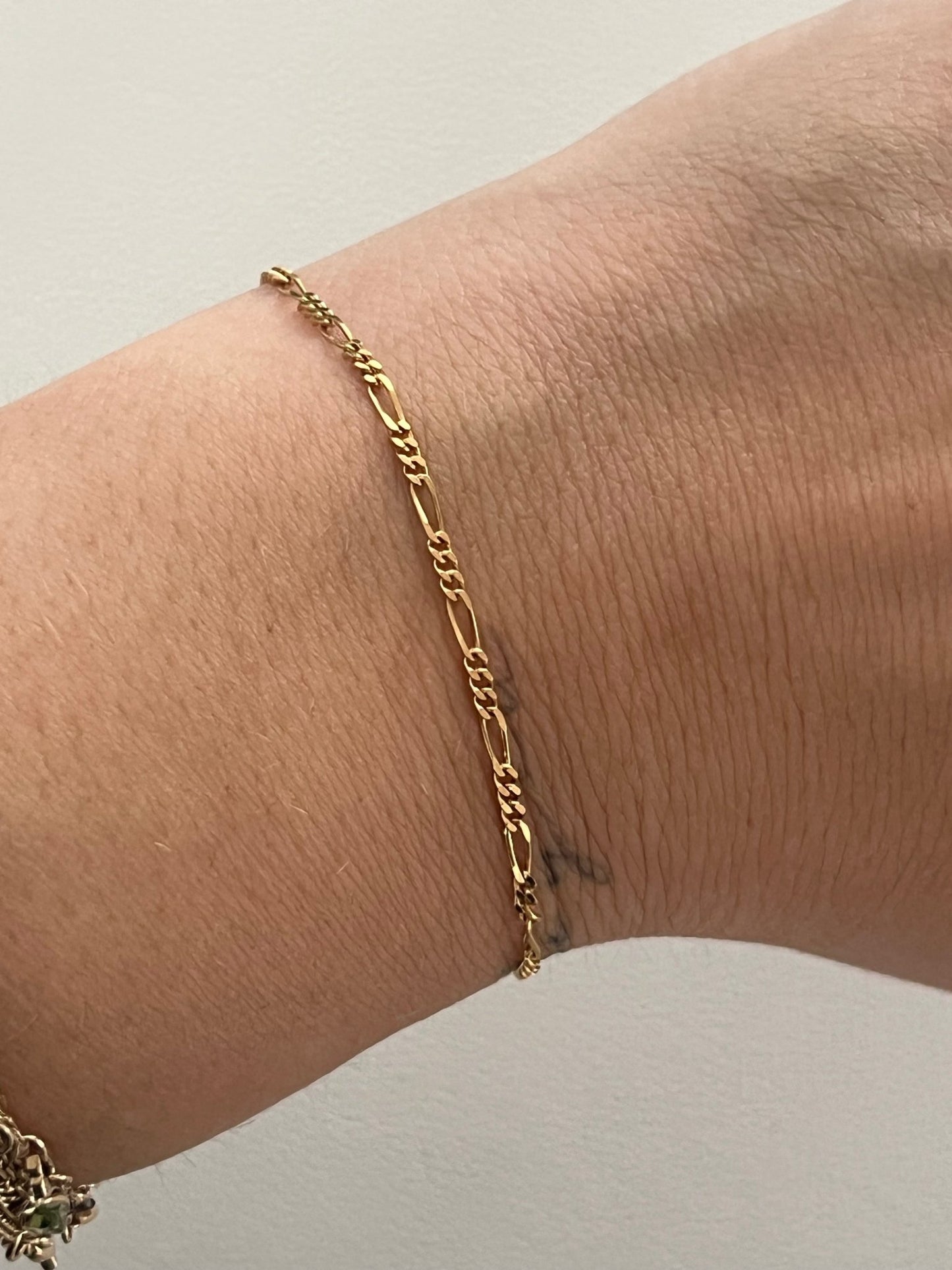 
                  
                    14k figaro bracelet - gldn grl
                  
                