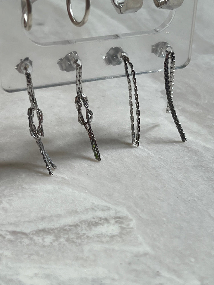 
                  
                    Silver dangling studs - gldn grl
                  
                