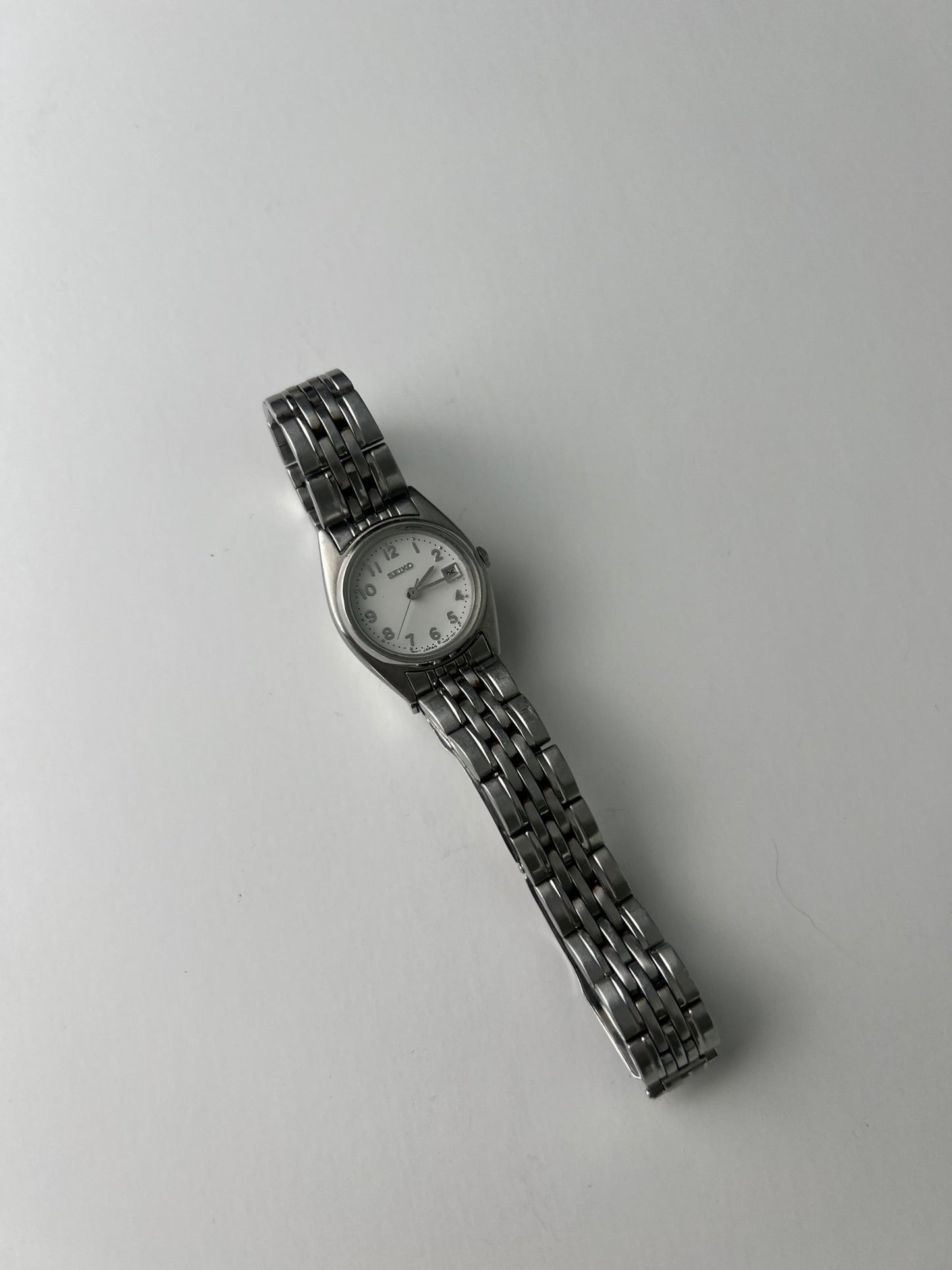 
                  
                    Silver Seiko watch - gldn grl
                  
                