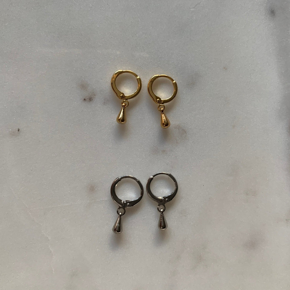 
                  
                    gold and rhodium courage hoops
                  
                