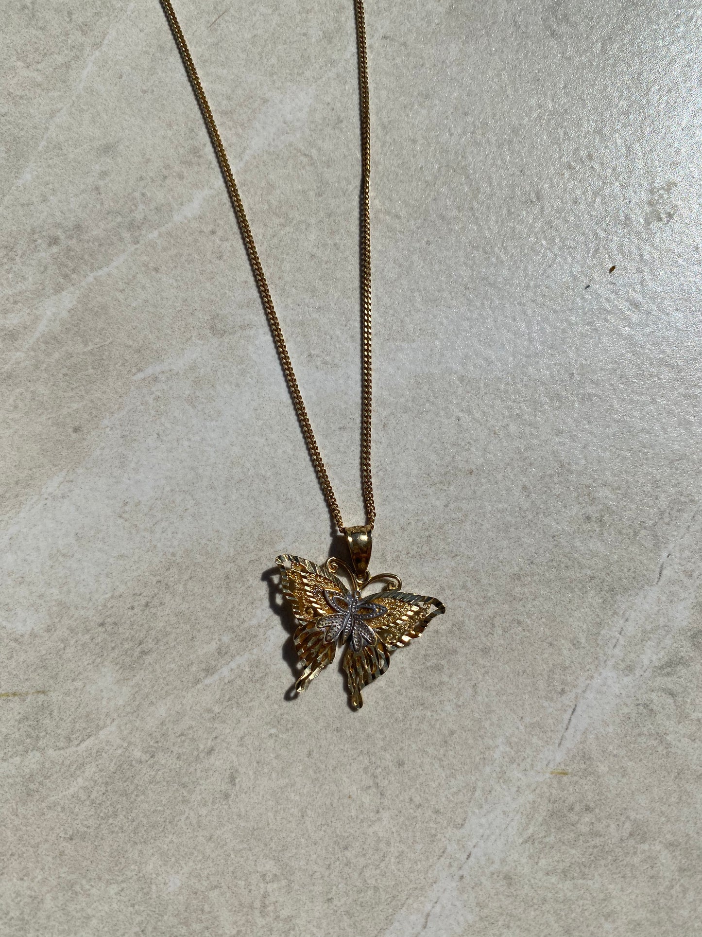 
                  
                    10k butterfly pendant
                  
                