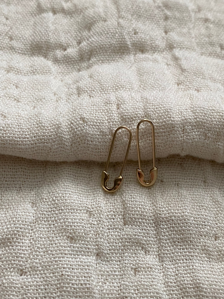 
                  
                    10k safety pin earrings
                  
                
