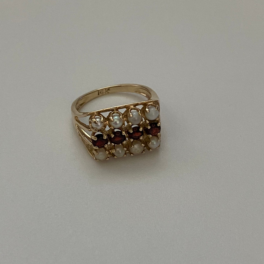 
                  
                    pearl and garnet ring
                  
                