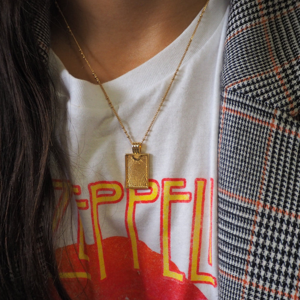 
                  
                    rosa necklace on model
                  
                