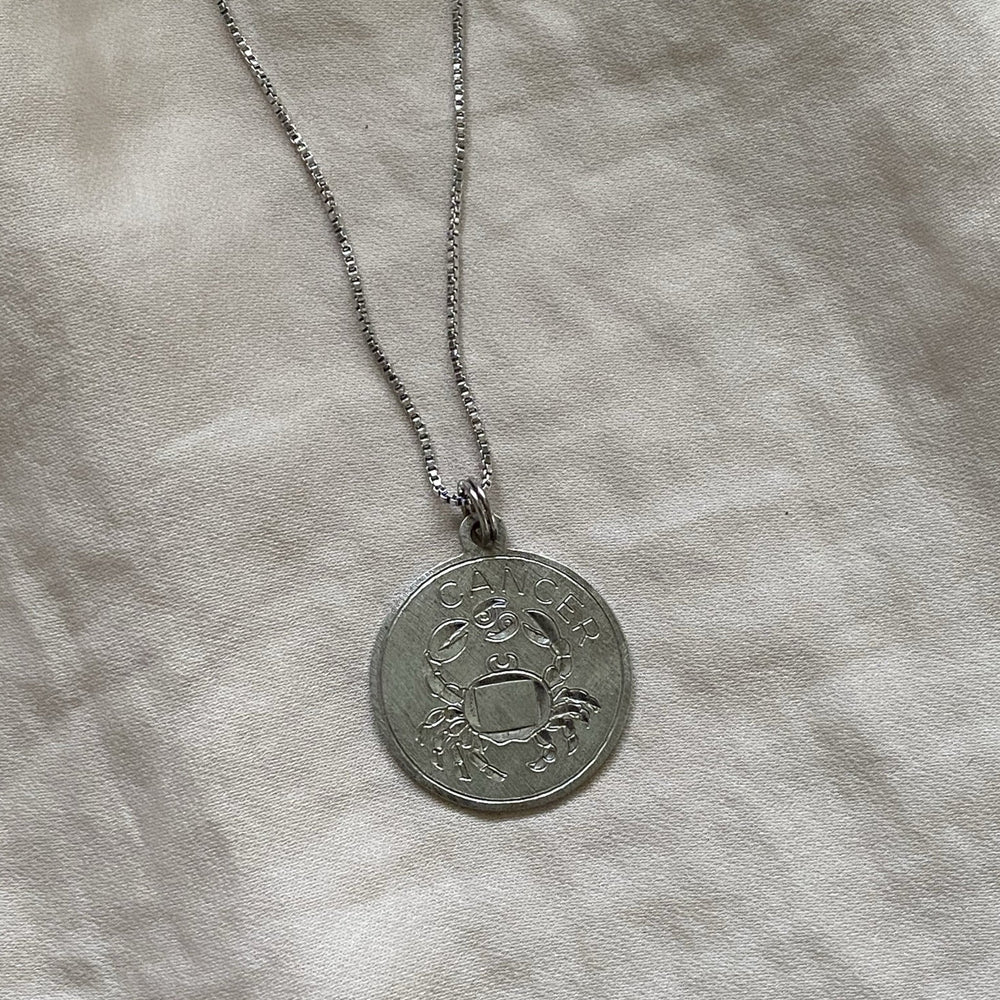
                  
                    silver cancer pendant
                  
                