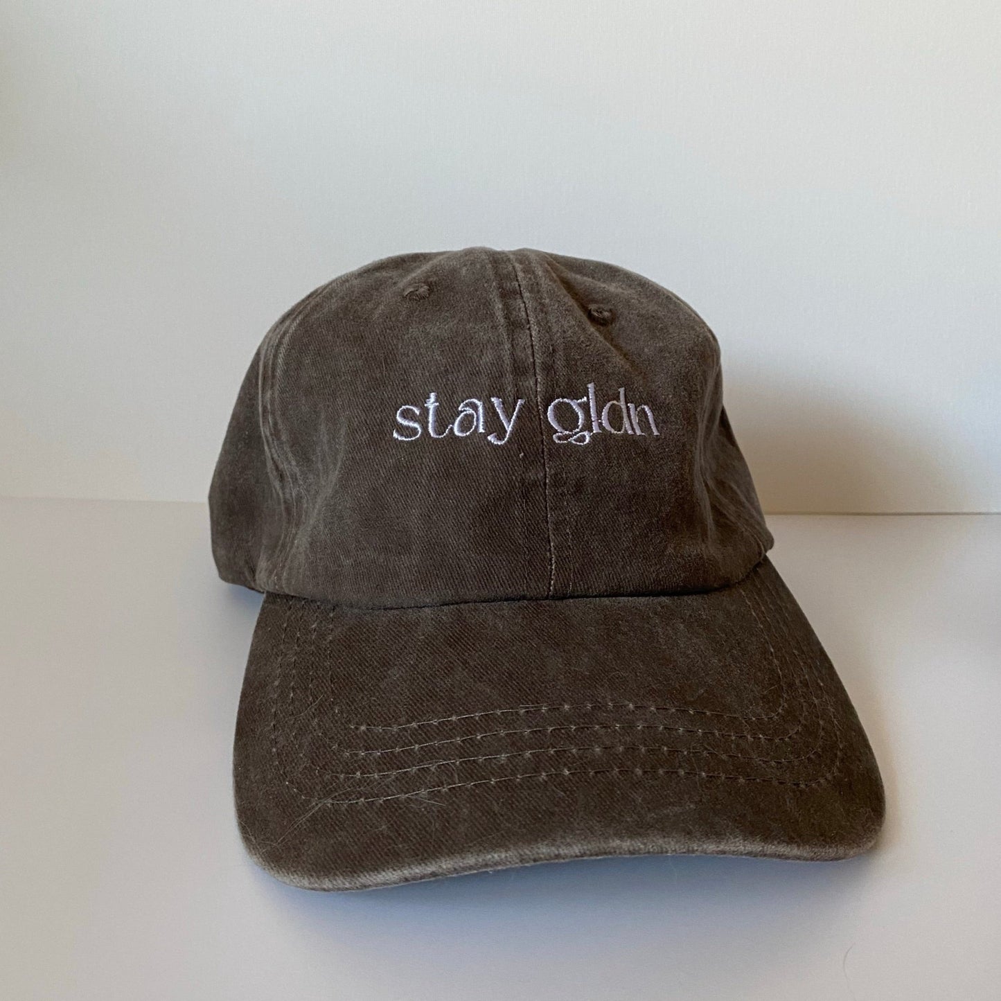 
                  
                    stay gldn hat
                  
                
